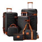 Black ribbed luggage collection with matching travel bag and pouch