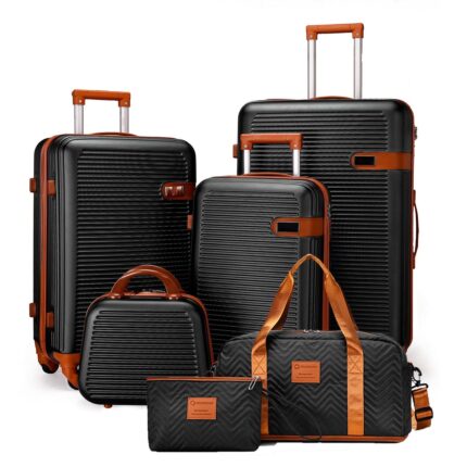 Black ribbed luggage collection with matching travel bag and pouch